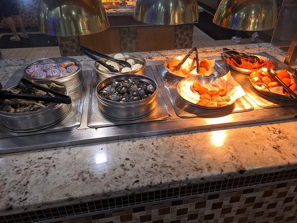 Printed menu showing adult and kids buffet options.